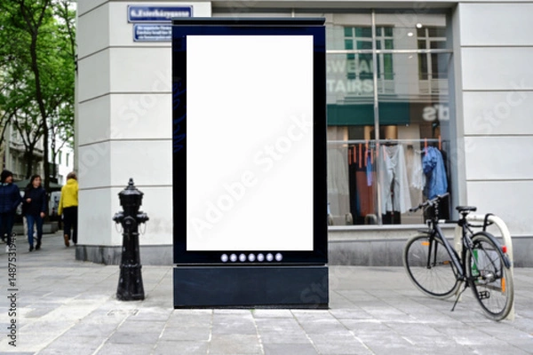 Fototapeta blank digital ad panel. billboard display. empty white lightbox sign on a popular shopping street. mockup template. city transit station. European street setting. outdoor advertising.
