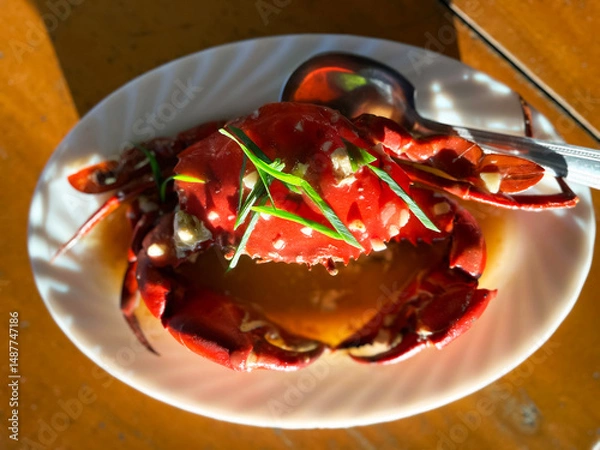 Fototapeta large boiled crab with spices on a plate