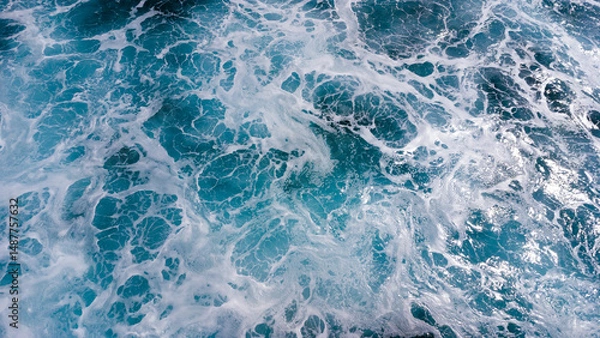 Fototapeta ocean surface foaming from waves, texture and shape of sea water, aerial view