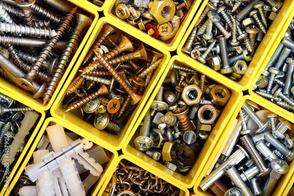 Fototapeta Screws, bolts, nuts and other carpenter stuff in plastic toolbox