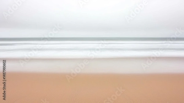 Obraz A serene coastal landscape with soft, blurred waves.
