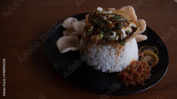 Fototapeta Rice with Fried Egg, Sweet Soy Sauce, and Crackers