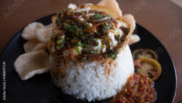 Fototapeta Rice with Fried Egg, Sweet Soy Sauce, and Crackers