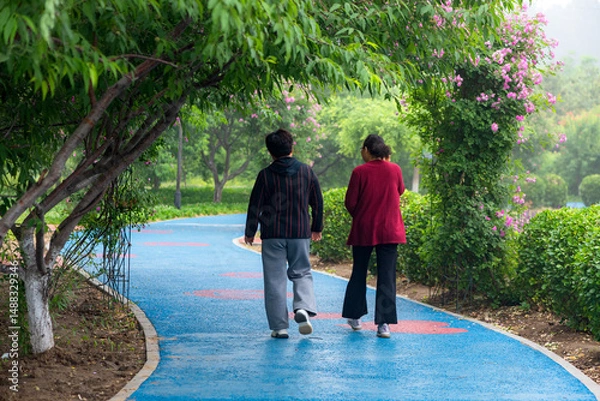 Obraz Luannan County, Hebei Province, China - May 2024: People taking morning walks and doing exercises in urban parks to exercise their bodies