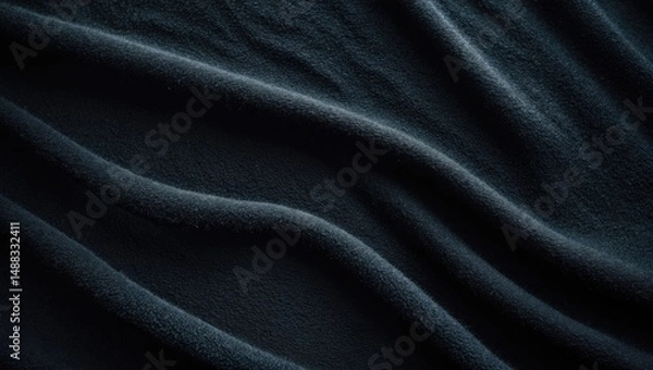 Fototapeta Dimly lit black furry material with focus on its soft, textured appearance