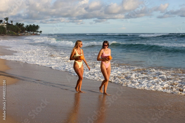 Fototapeta Enjoy a sunkissed beach adventure packed with fun and excitement with coconut