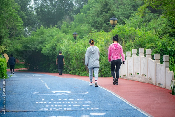 Obraz Luannan County, Hebei Province, China - May 2024: People taking morning walks and doing exercises in urban parks to exercise their bodies