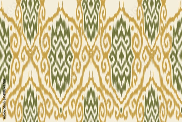 Obraz Seamless green and yellow ethnic ikat pattern with traditional ornamental shapes and swirl motifs. Decorative abstract textile design for fabric, wallpaper, and wrapping.
