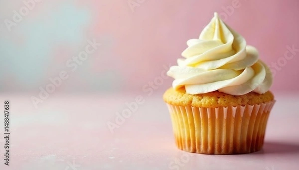 Obraz Swirled buttercream frosting on vanilla cupcake, sugar, white, yellow