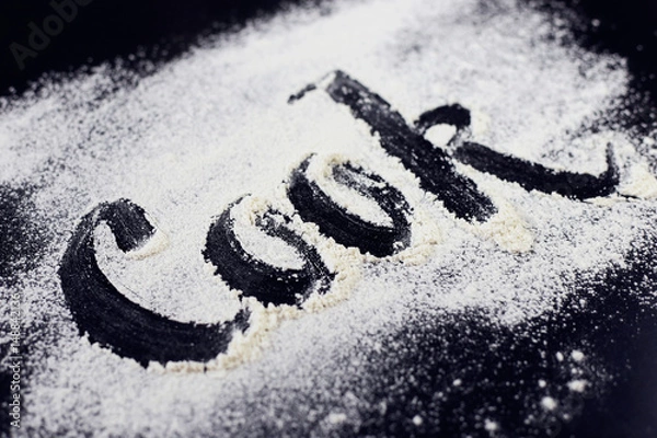 Obraz The inscription on the flour. Cook. Black background