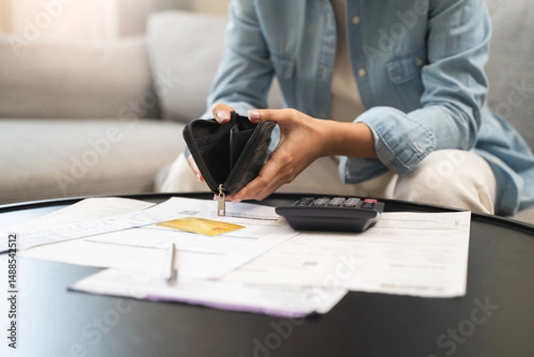 Fototapeta person opening wallet on the table have invoice and loan document.