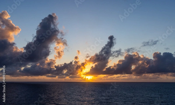Fototapeta Sunset Over The Ocean with Vibrant Clouds and Radiant Sky