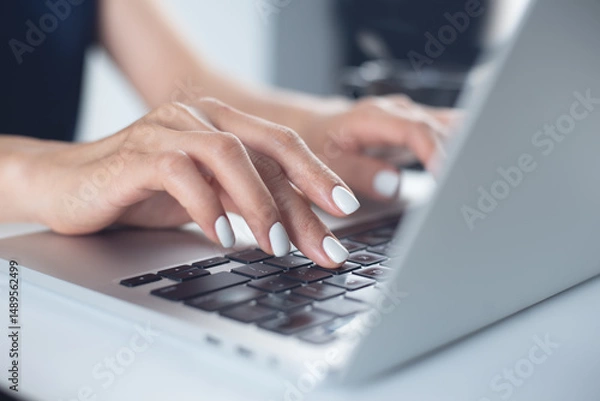 Obraz Business woman typing on laptop computer keyboard on office table, close up. online job, surfing the internet, remote work concept