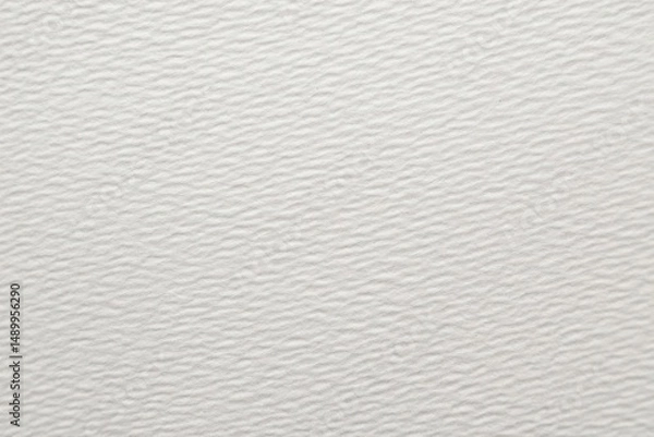 Fototapeta Textured white paper background with subtle waves, perfect for artistic projects and design work.