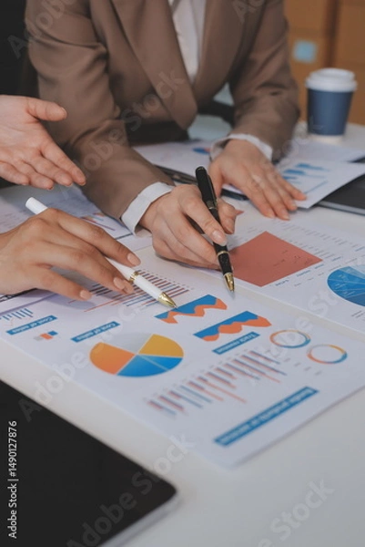 Fototapeta Accounting company provide finance and taxation planning for profitable cash flow, Auditor and accountant team working in office, analyze financial data and accounting record with calculator.Insight
