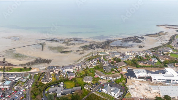 Fototapeta Aerial view of coast of Irish Sea and Mourne Mountains in Newcastle, Northern Ireland. Drone photo of Coastal City and water. 