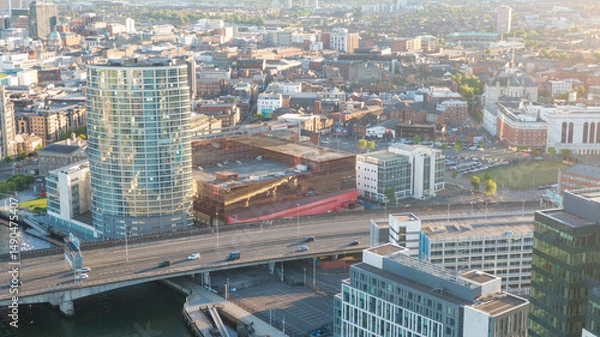Fototapeta Aerial view on Lagan River and buildings in City centre of Belfast Northern Ireland. Drone photo, high angle view of town