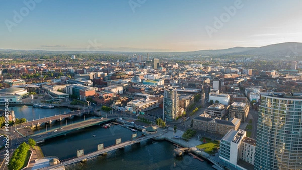 Fototapeta Aerial view on Lagan River and buildings in City centre of Belfast Northern Ireland. Drone photo, high angle view of town