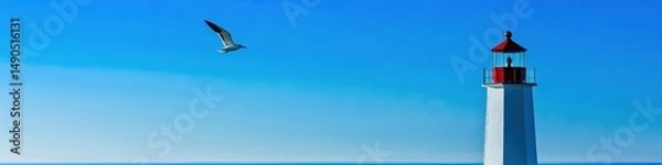 Fototapeta Majestic Red and White Lighthouse Against Clear Blue Sky: Iconic Coastal Beacon with Flying Bird. Striking Nautical Scene for Creative Advertising, Commercial Backgrounds, and Maritime-Themed Designs.