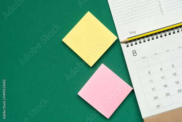 Fototapeta close up of calendar on the green table background, planning for business meeting or travel planning concept