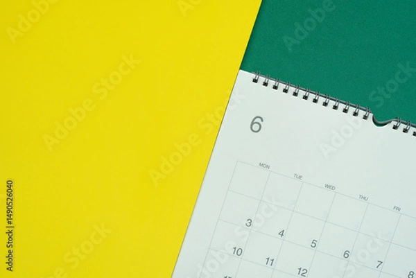 Fototapeta close up of calendar on the colorful  table background, planning for business meeting or travel planning concept