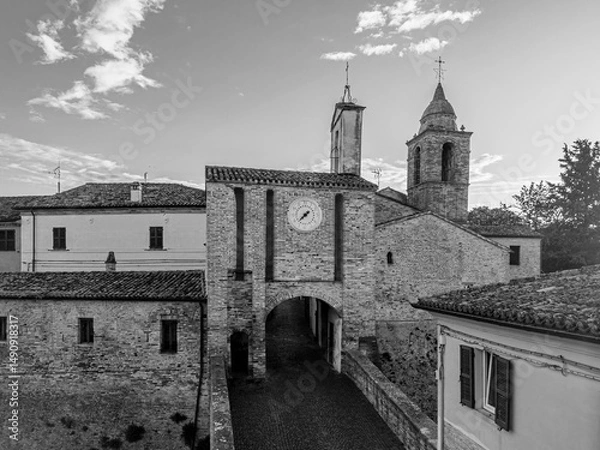 Fototapeta Italy, May 15, 2025: aerial view of the medieval village of Candelara in the province of Pesaro in the Marche region. The town exudes ancient history and serenity

