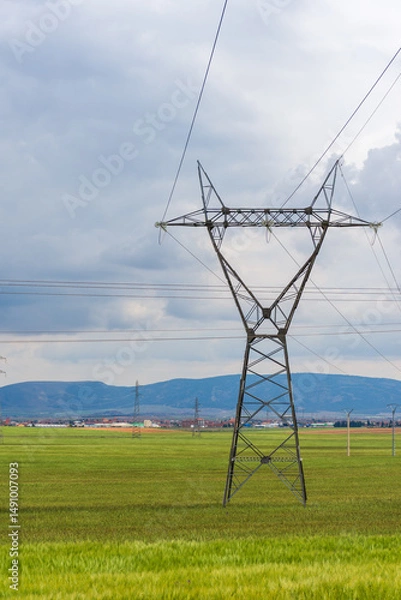 Fototapeta High voltage power lines in the field in Setif City, Algeria.