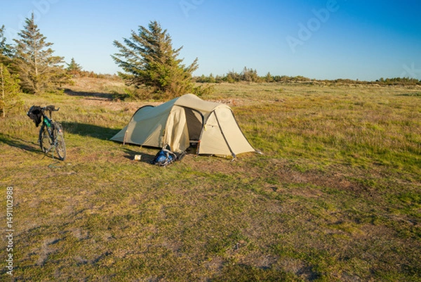 Fototapeta tent on a meadow in the evening light
