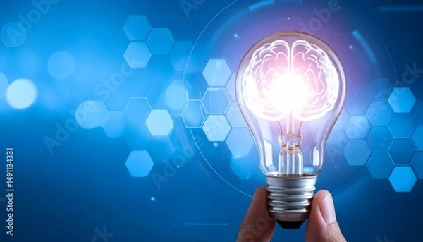 Fototapeta Glowing brain inside lightbulb on a blue tech background held by a hand
