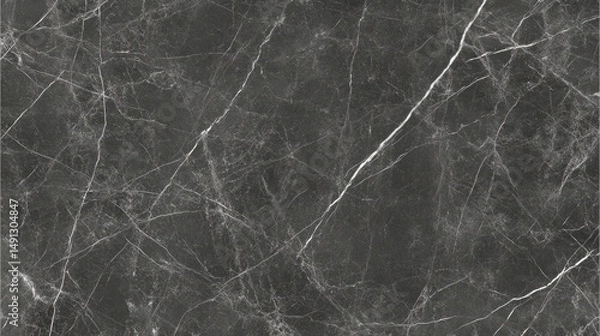 Fototapeta Dark grey marble surface with intricate veining pattern.