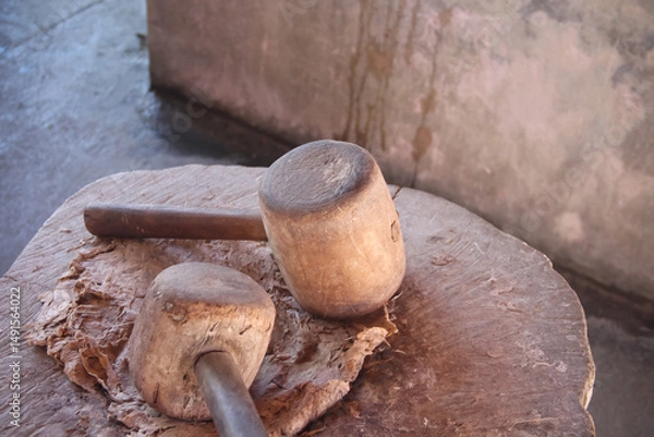 Fototapeta Close up wood hammer with handle for smash dry broussonetia papyrifera the step to make sa paper mulberry