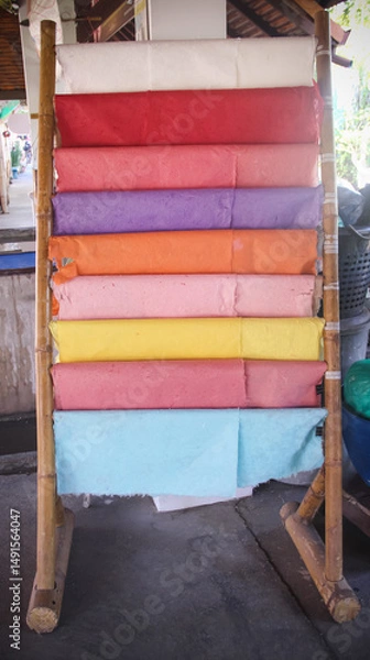 Fototapeta Multicolored mulberry sa paper texture hanging on wood structure