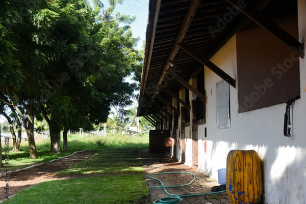 Fototapeta equestrian architecture, stable, architecture, horse stable in equestrian center, riding school, riding stable, horse stalls
