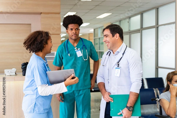 Fototapeta Team of diversity doctor and nurse is discussing and brainstorming over patient medical record after diagnosis for precise care plan with experienced senior physician specialist