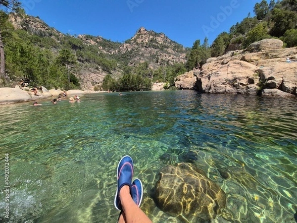 Obraz feet of a relaxed person with bathing shoes at a swimming and bathing pool "soli solenzara" in corsica