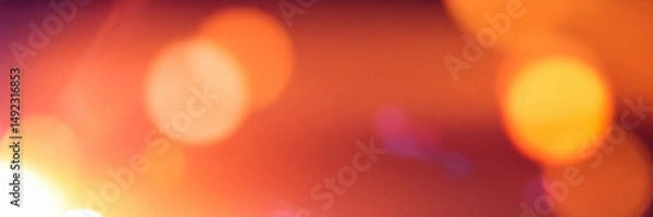Fototapeta Warm glow of abstract light bokeh in a dreamy sunset atmosphere for banner and header design