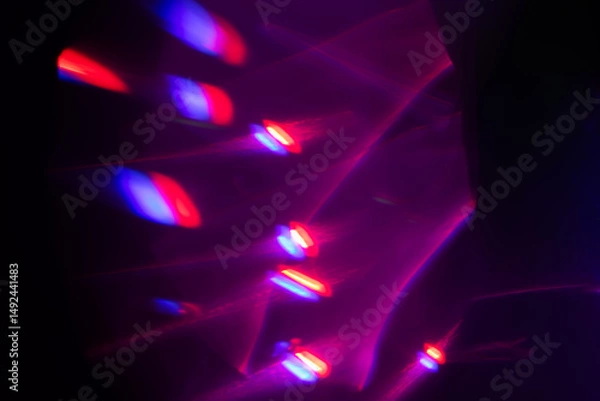 Fototapeta Blurred Light painting one exposure in camera. light glares with a spectral gradient on a dark background.