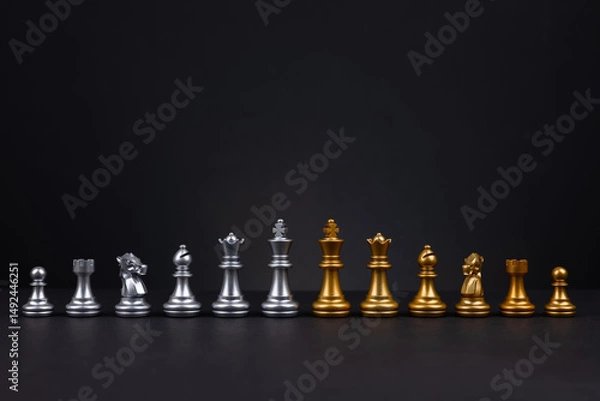 Fototapeta Golden and silver chess include king queen horse ship and pawn on dark background for business battle