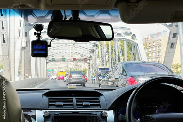 Fototapeta View from inside of the car show traffic ahead while driving across the bridge on the road of Bangkok Thailand.Image use for holiday travel presentation background.
