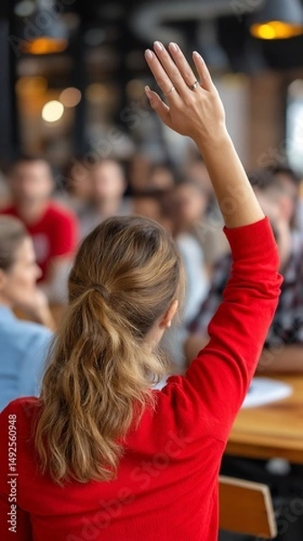 Fototapeta Woman raising hand in meeting, asking question, business conference, useful for educational or business articles