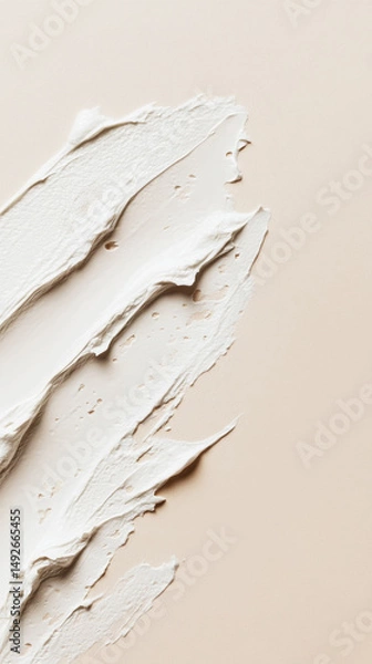 Fototapeta Close-up of smooth white cosmetic cream or makeup foundation smeared on a soft beige background. Generative AI