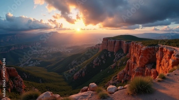 Fototapeta A panoramic view of Posets Maladeta in Spain at dawn, with cloudy skies and misty mountain peaks.