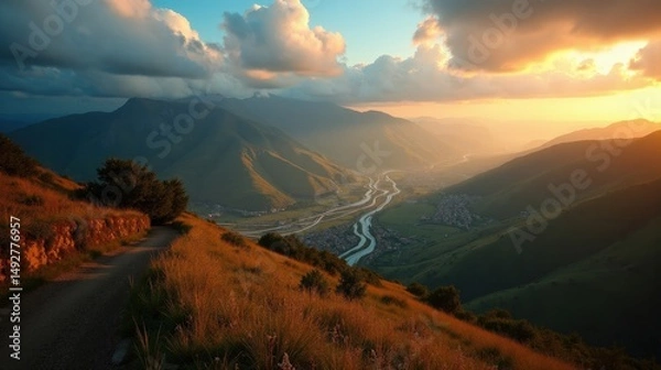 Fototapeta Aerial view of Aralar in Spain at dawn, with cloudy skies surrounding rugged hills and valleys.