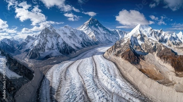 Fototapeta A dramatic aerial view of Mount Everest, with glaciers and snowfields surrounding it