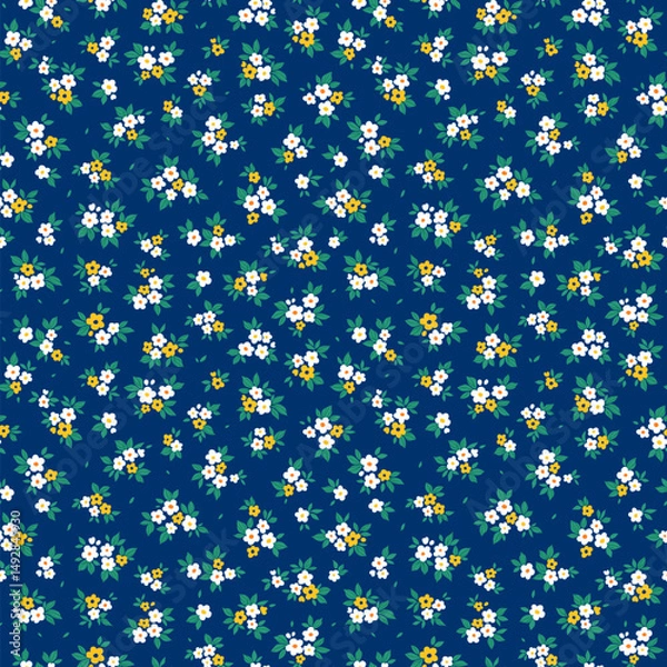 Obraz Beautiful floral pattern in small abstract flowers. Small white and yellow flowers. Blue background. Ditsy print. Floral seamless background. Cute template for fashion prints. Stock 