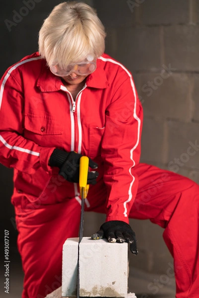 Obraz Vertical image of a female mason.