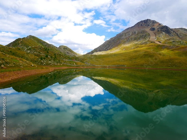 Fototapeta View on a lake and mountains above Defereggental valley on a summer day