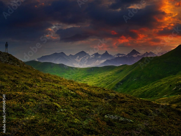 Fototapeta Man tourist watching mountains near Saalbach Hinterglemm Leogang ski resort during summer day, Creative post processing