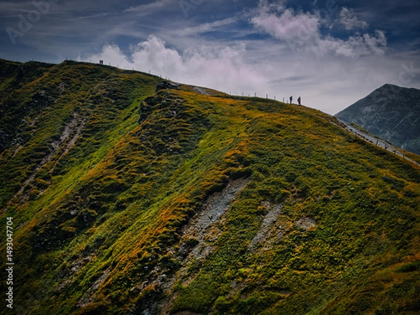 Fototapeta People walking on a mountains range  near Saalbach Hinterglemm Leogang ski resort during summer day