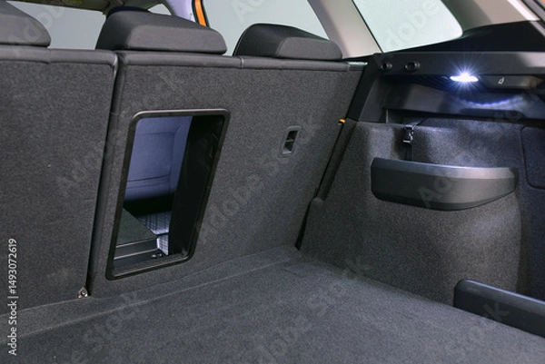 Fototapeta Ski hatch on the rear seat backs in the car